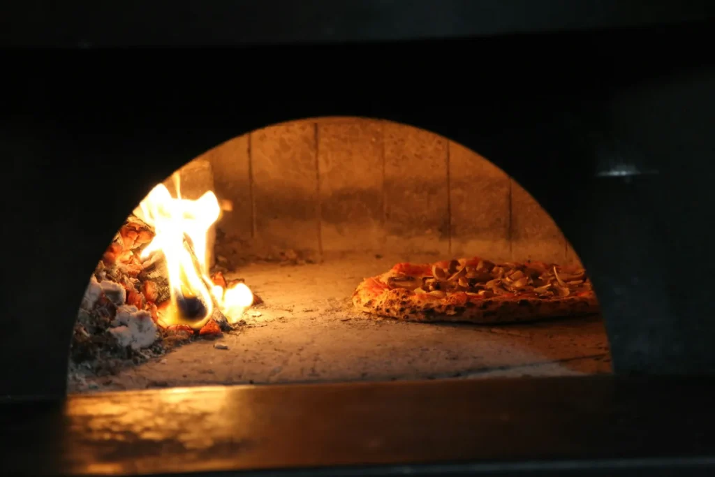 Wood oven with a fire burning inside