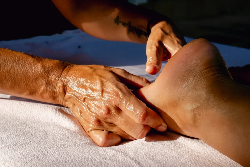 Foot massage in warm light