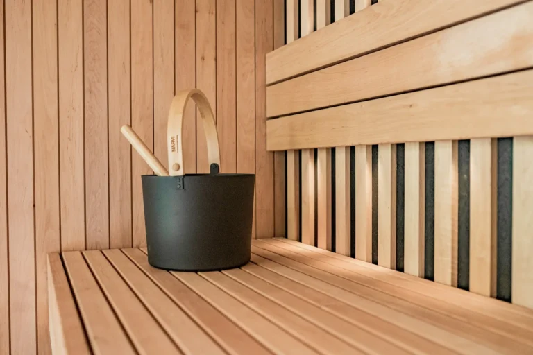 Sauna bucket on a cedar bench
