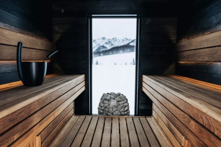 Dark sauna looking out to the snow