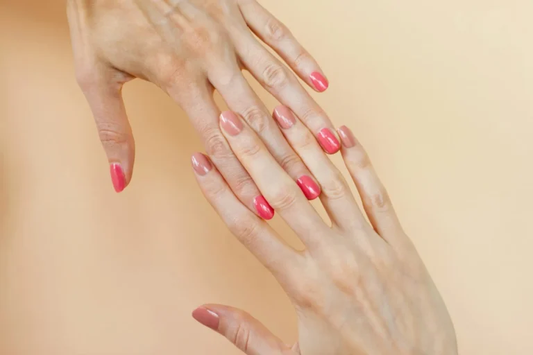 Pink nails on a peach background
