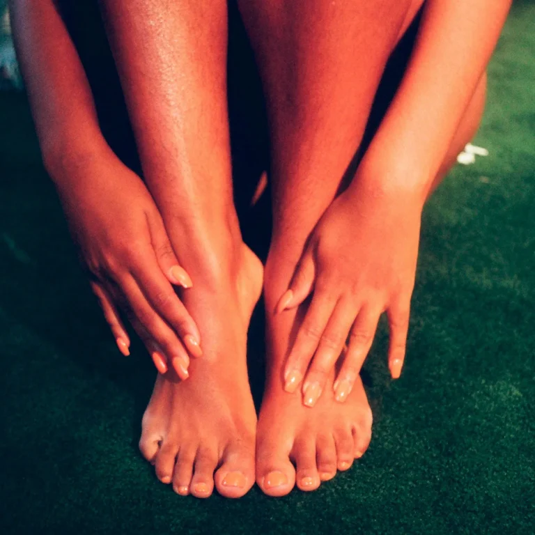 Feet on a green rug
