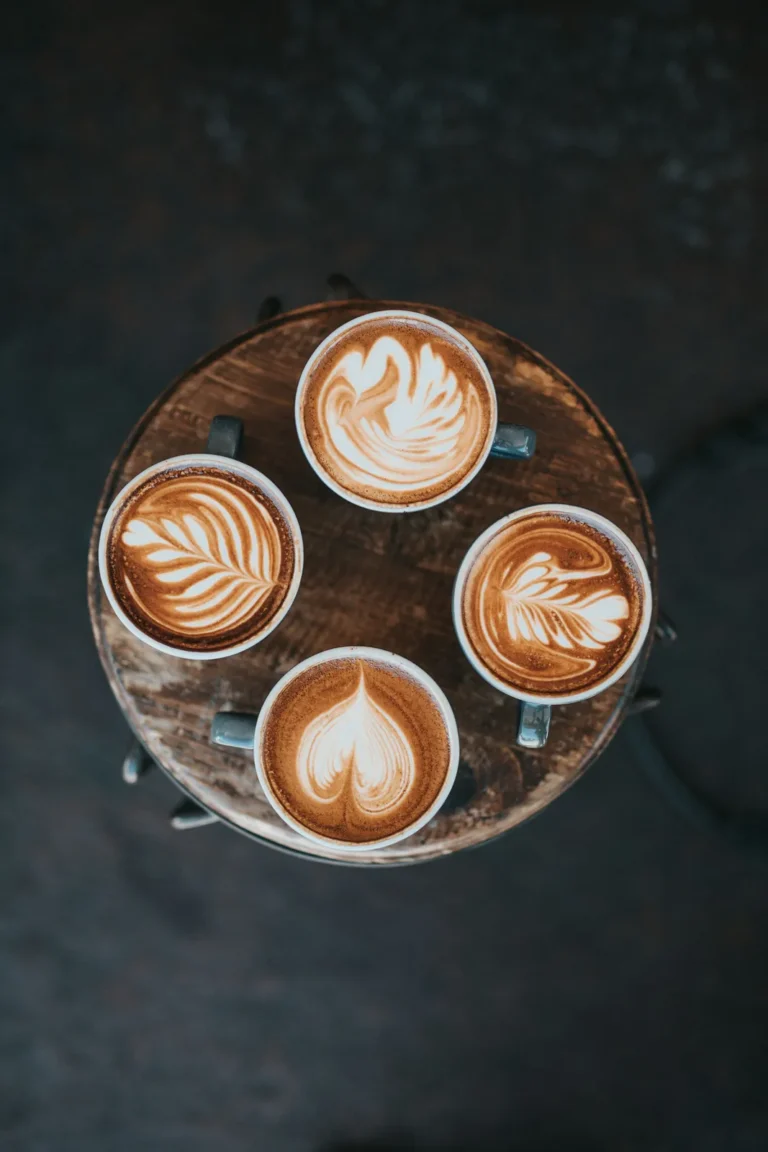 Four lattes on a round table