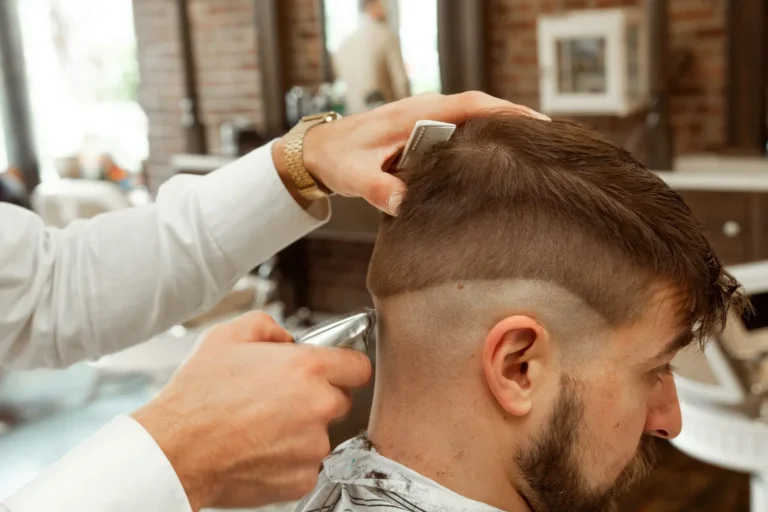 Barber cutting a side part