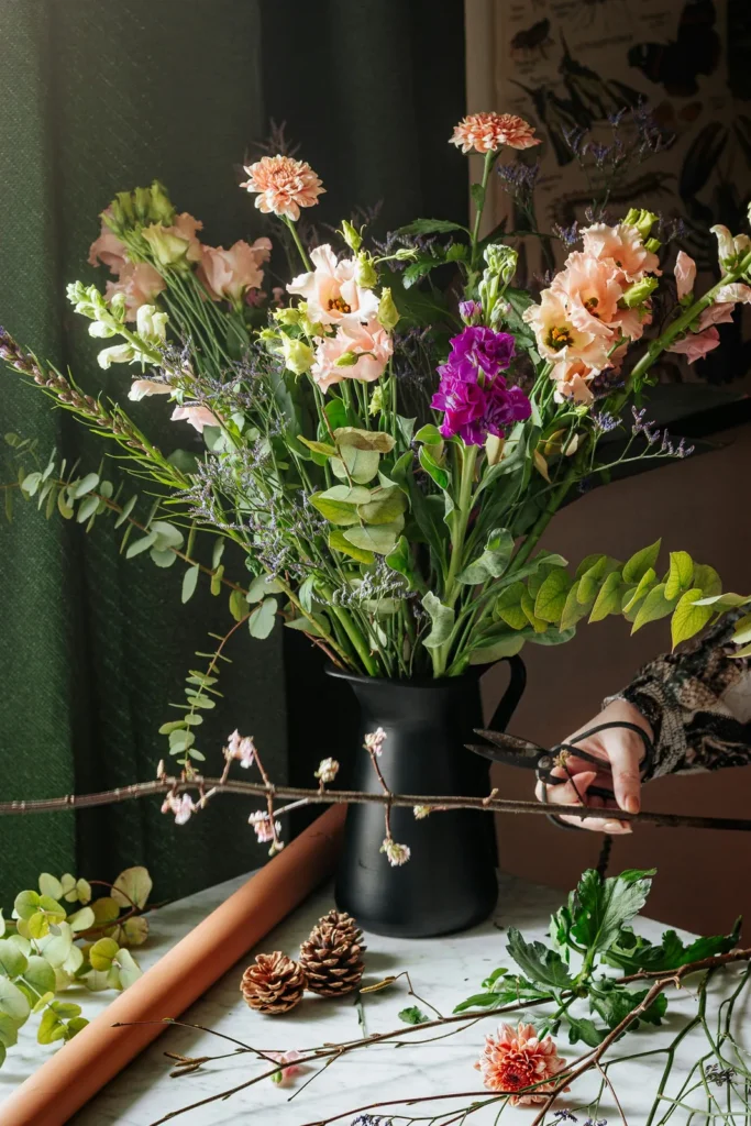 Arranging flowers in a jug
