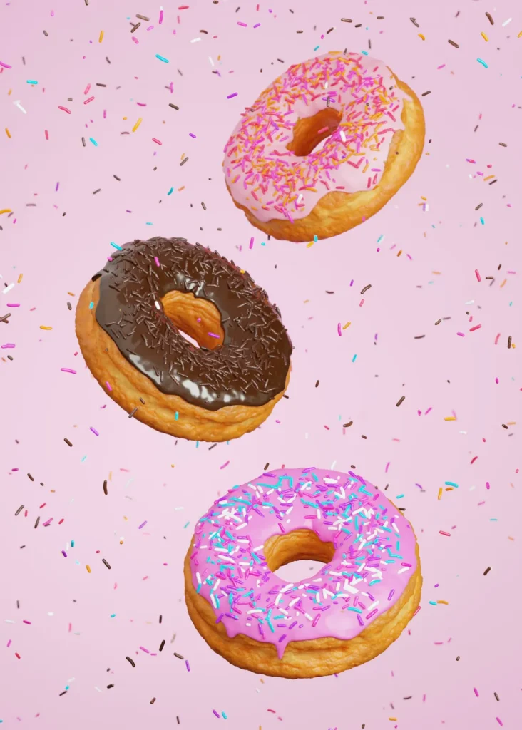 Chocolate donut and sprinkles on pink