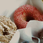 Sugared donuts on paper