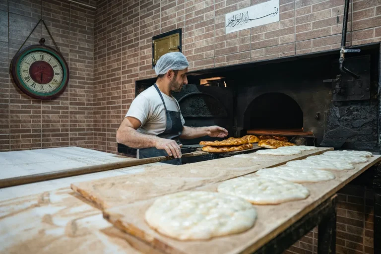 Baker working at the oven