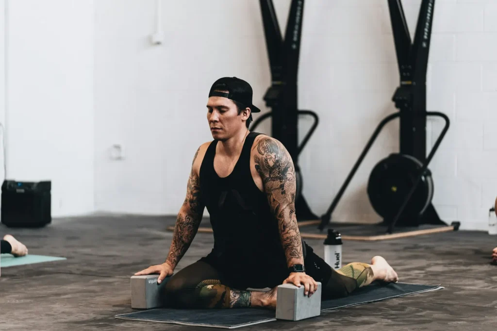Athlete stretching with yoga blocks
