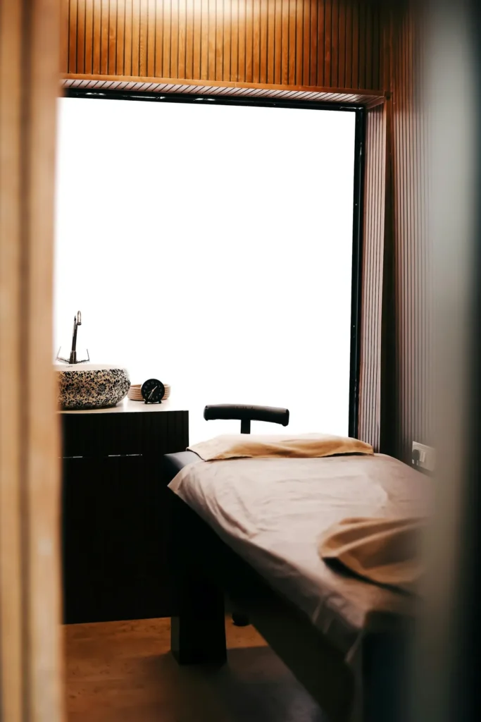 Quiet treatment room with a bed by the window