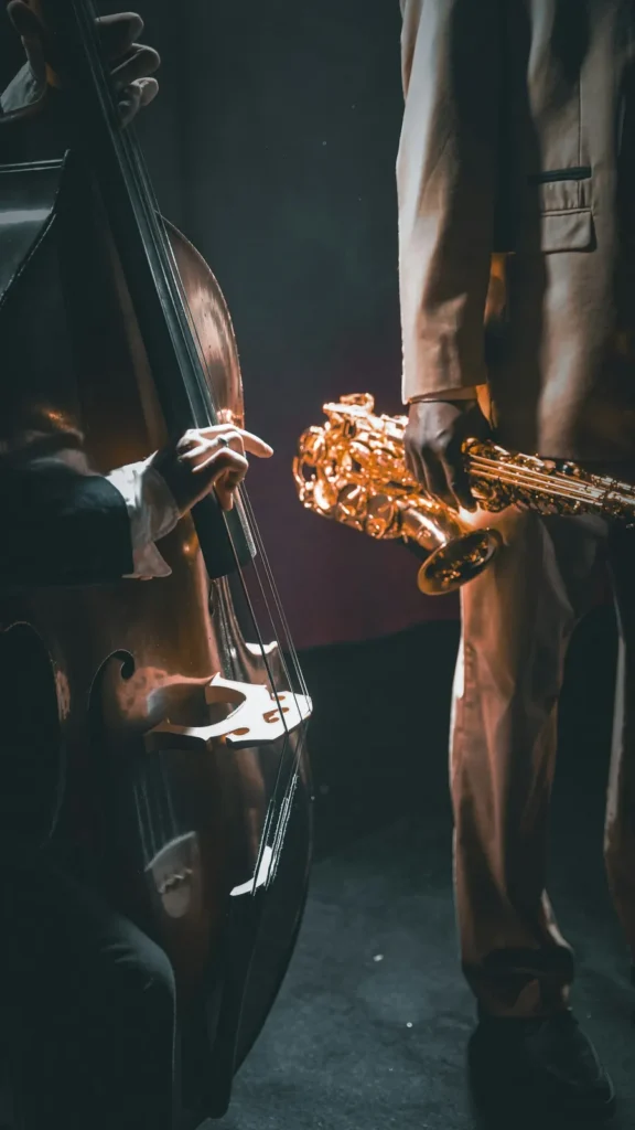 Double bass and saxophone players on stage