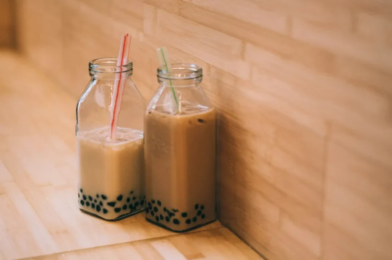 Two bottles of milk tea with pearls