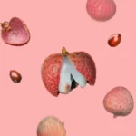 Fresh lychees on a pink background