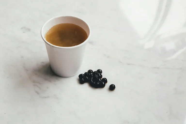 Cup of tea with tapioca pearls on marble