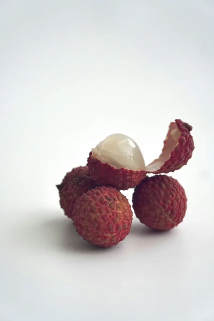 Peeled lychee on white