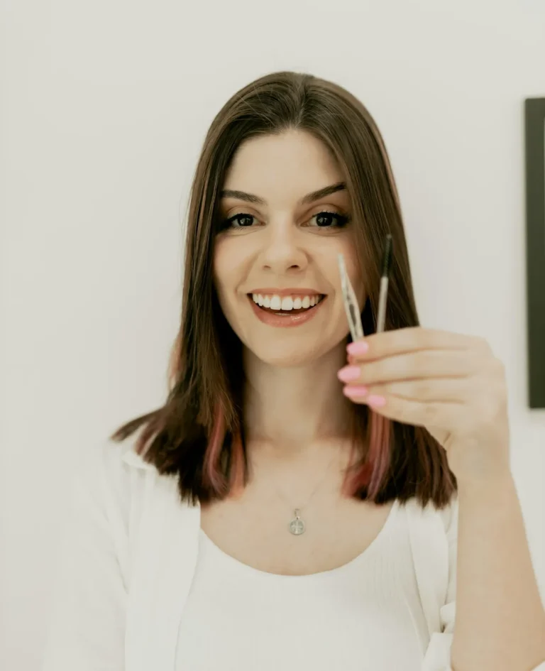 Nail technician smiling in the studio