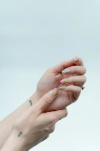 Tiny hand-painted art on short nails