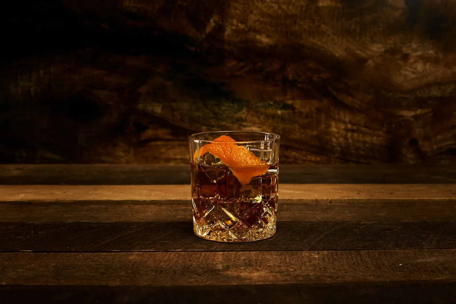 Whiskey cocktail on a wooden bar
