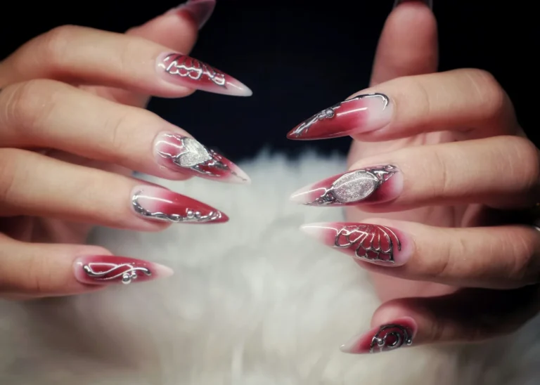 Rose chrome stiletto nails with silver lines