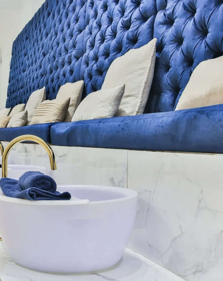 Blue velvet pedicure bench with brass taps