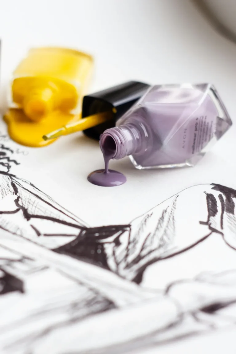 Yellow and lilac polish spilling