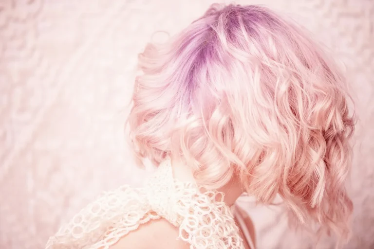 Pastel pink curls from behind