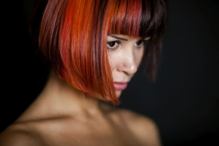 Red bob with a blunt fringe