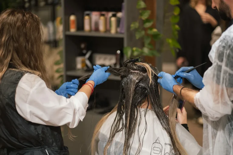 Two colorists applying color together