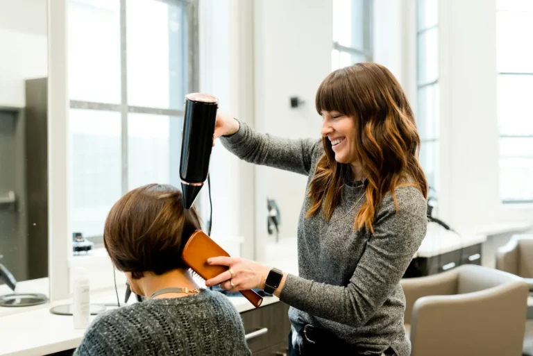 Stylist blow-drying a bob