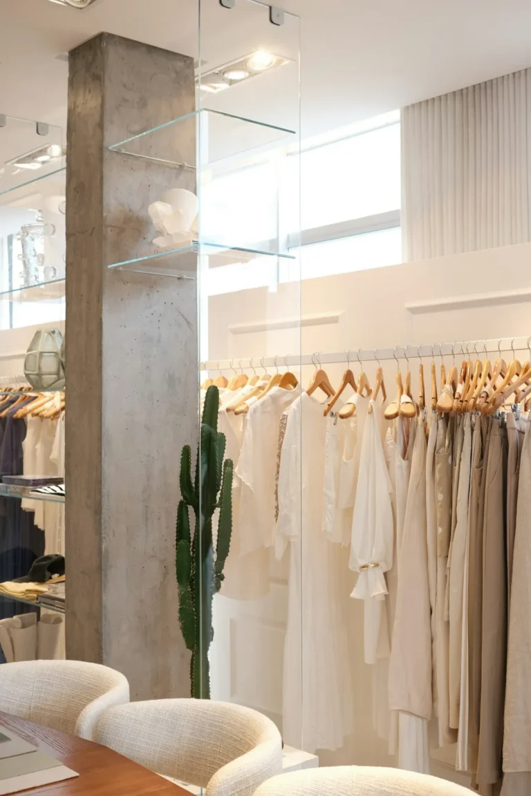 White linen pieces on a rail in the boutique