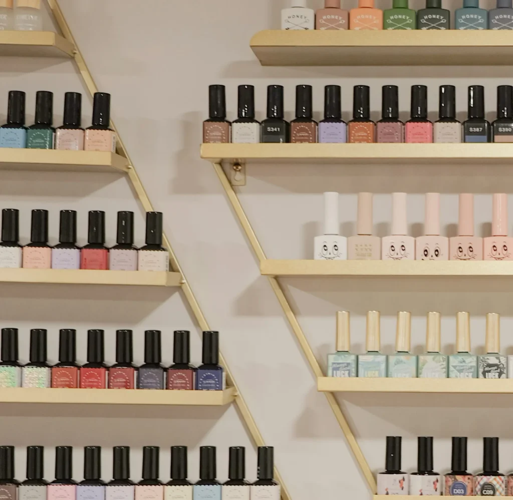 A wall of nail polish colors in a salon