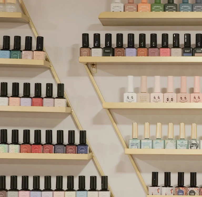 A wall of nail polish colors in a salon